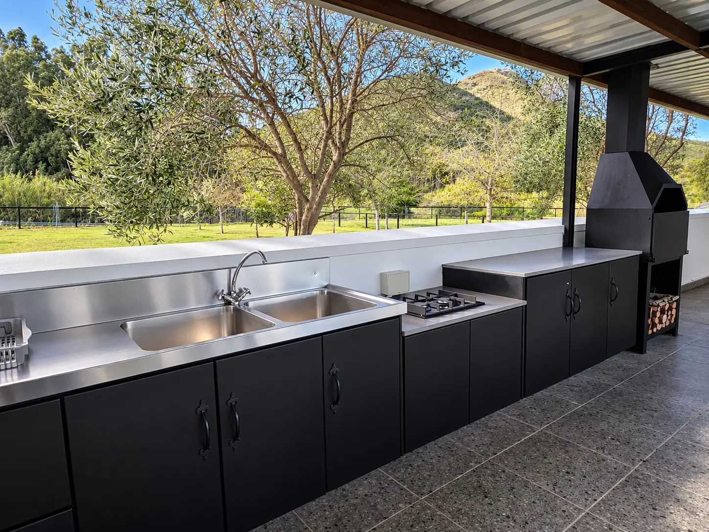 Outdoor preparation kitchen and covered braai area at the Strings accommodation