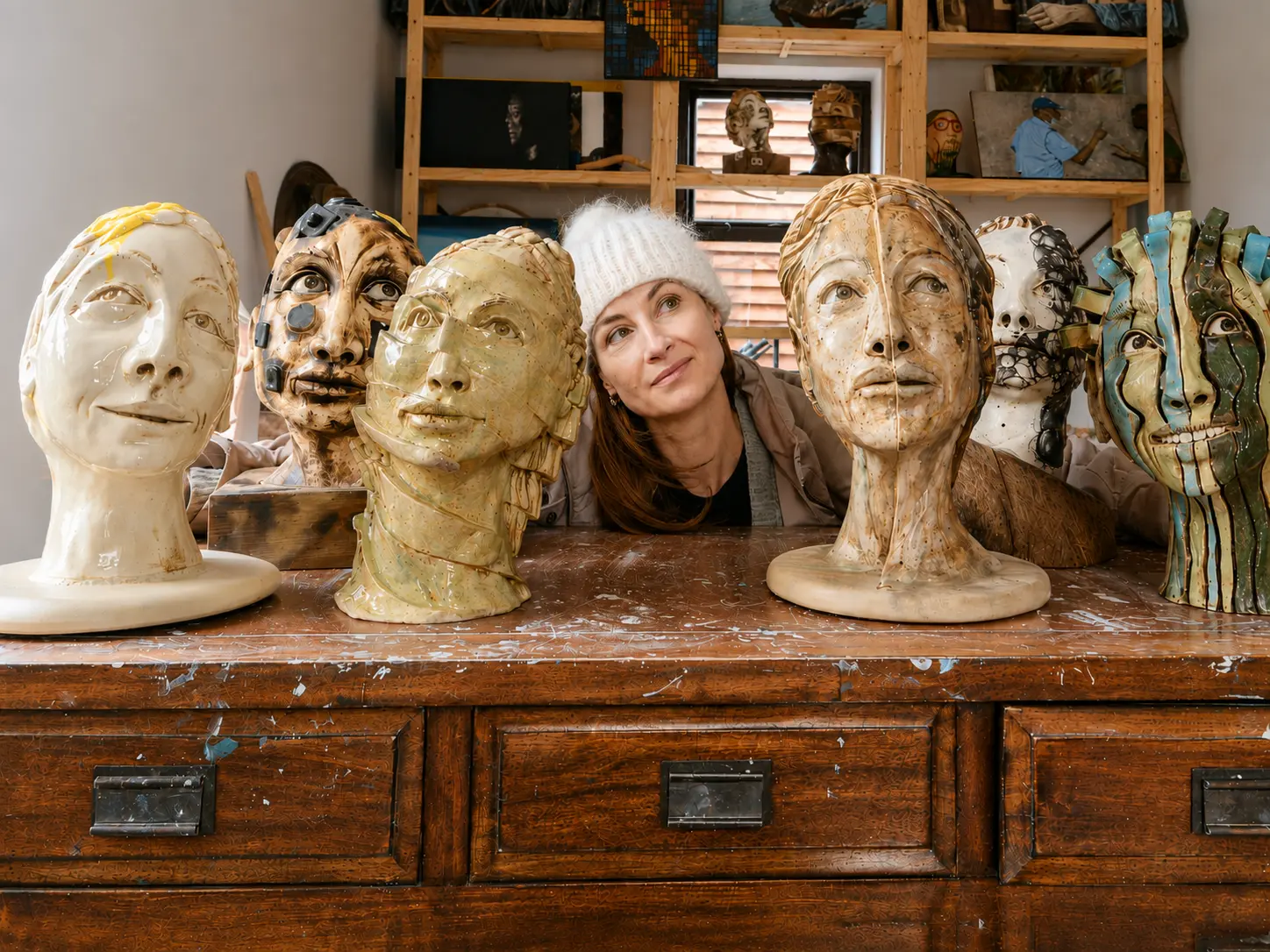 Elzeth Jacobs surrounded by her sculptural works in her Klawerjas studio